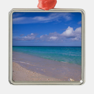 Cloud in blue sky over sandy beach metal tree decoration