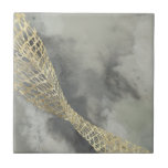 Cloud Matrix Ceramic Tile<br><div class="desc">Cloud Matrix II by Jennifer Goldberger. Features a gold,  mesh-like shape against a contrasting cloud-like grey background.</div>
