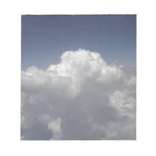 Clouds at 30,000 feet from an aeroplane window notepad