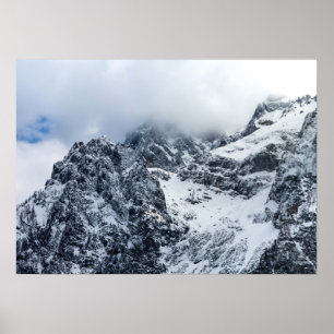 Clouds covering majestic mountains poster