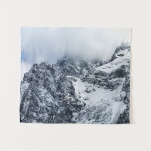 Clouds covering majestic mountains tapestry