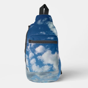 Clouds in the sky sling bag