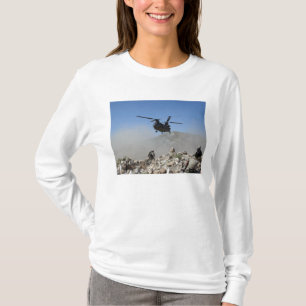 Clouds of dust kicked up by the rotor wash T-Shirt
