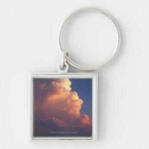 Clouds over sea at sunset key ring