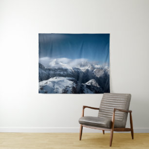 Clouds rolling above snowy mountains tapestry