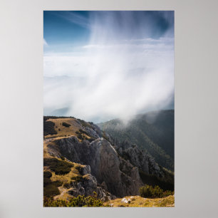 Clouds rolling over mountains poster