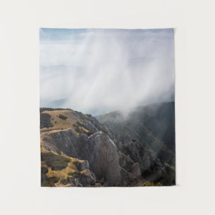 Clouds rolling over mountains tapestry