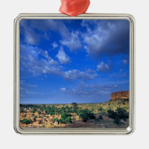 Clouds sweeping across the sky over the metal ornament