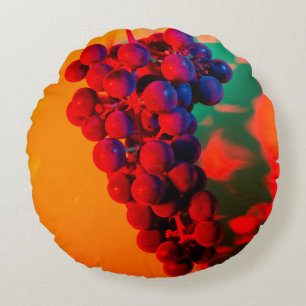 Cluster of blue grape in orange neon light. Food b Round Cushion