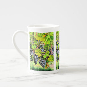 "CLUSTERS OF BLUISH PURPLE GRAPES IN VINEYARD" BONE CHINA MUG