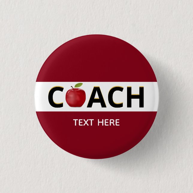 Coach text with apple on burgundy button (Front)