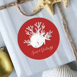 Coastal Beach Christmas Red Seas and Greetings Classic Round Sticker<br><div class="desc">These holiday tropical beach “seas & greetings” stickers feature a white sand dollar and 2 white starfish on silver glitter coral,  with a Christmas red background.  *If you would like this design on more products or need design help,  please contact me through Zazzle Chat.</div>