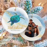Coastal Beach Sea Turtle Mele Kalikimaka Photo Ceramic Ornament<br><div class="desc">This Hawaiian tropical coastal themed holiday ornament is easily personalised with family name on the front and a photo on the back, and features a watercolor turquoise blue sea turtle on an abstract beach background with a faux gold glitter sparkly wave, and gold Mele Kalikimaka. Check out the collection for...</div>