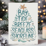 Coastal Christmas Tree Beach Holiday Card<br><div class="desc">Celebrate the holiday season with coastal vibes! This "Bay Tide Breeze Seaglass Shoreline" Christmas card brings a fresh, breezy feel with its oceanic design. Featuring seaside elements like starfish, seashells, and soothing blue tones, this card is perfect for anyone who loves the beach. Whether you're sending warm Christmas wishes from...</div>