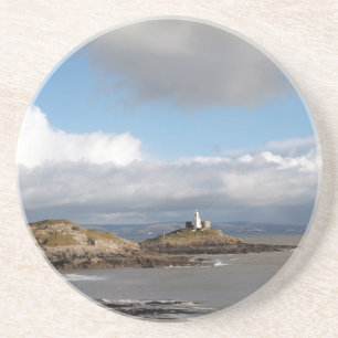 Coastal landscape and lighthouse coaster