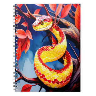 Cobra with vibrant red and yellow scales in tree notebook