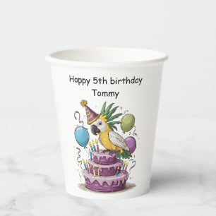 cockatoo perched on birthday cake balloons paper cups