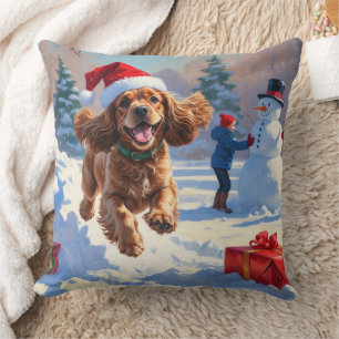 Cocker Spaniel Running in Snow with Christmas Hat Cushion