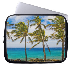 Coconut palm trees (Cocos nucifera) swaying in Laptop Sleeve