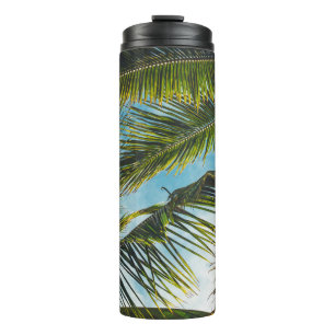 Coconut tree leaves under blue sky in the morning thermal tumbler