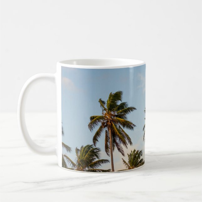 Coconut trees under cloudy sky in the morning coffee mug (Left)