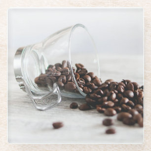 Coffee Beans Spilling out of a Clear Coffee Cup Glass Coaster