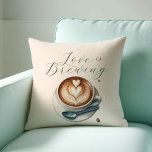 Coffee Lover Themed Love Is Brewing Throw Pillows<br><div class="desc">Are you looking for more coffee bridal shower theme ideas? Say ‘Love Is Brewing Bridal Shower Do Tell A Belle’ to find us online. Add a cosy touch to your home or event with our coffee lover themed throw pillow, featuring the charming phrase "Love is Brewing" alongside delightful illustrated coffee...</div>