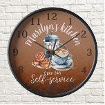 Coffee-themed Wall Clock<br><div class="desc">At the centre of the clock, you'll find an intricately designed coffee pot, coffee cup, ready to kickstart your day, and cinnamon rolls, freshly baked to perfection.
To make this coffee-themed wall clock truly your own, we offer the option to customise it with your name or a special message.</div>