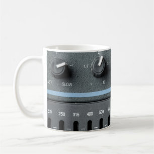Color image of many buttons in a sound recording s coffee mug