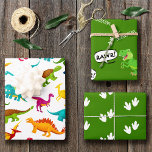 Colorful Dinosaur Pattern with Name Wrapping Paper Sheet<br><div class="desc">Does your little boy or girl love dinosaurs? This custom birthday party wrapping paper is perfect! There's a big T-Rex saying RAWR, dinosaur footprints and your little kid's name on white, a green background, and a fun colorful dino pattern. This gift wrap makes a great personalized addition to your present...</div>