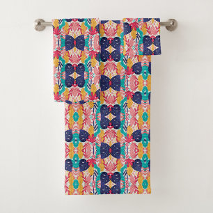 Colorful geometric-patterned towels hang 
