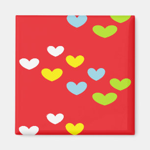 Colorful hearts on red magnet