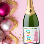 Colorful Merry Bright Pink Christmas Party Custom Sparkling Wine Label<br><div class="desc">Cute and cheerful holiday party champagne labels featuring a colorful strand of Christmas lights wrapped around your vibrant script. May Your Days Be Merry and Bright written in bold letters from light blue to your family name in hot pink. A rainbow of colors on cute decor for the holidays with...</div>