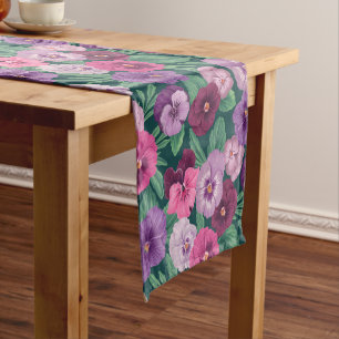 Colorful pansies on dark greenish blue short table runner