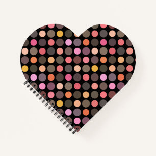 colorful polka dots on black notebook