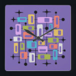 Colorful Retro Mid Century Modern Atomic Abstract Square Wall Clock<br><div class="desc">This artwork radiates mid-century modern energy, layering vibrant rectangles and squares of orange, green, blue, pink, purple, and white within a black grid of lines and dots. The composition is punctuated by playful black starbursts, evoking the optimism of the atomic age. Set against a deep purple background, the symmetry and...</div>