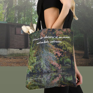 Colorful trees reflecting upon the calm water tote bag