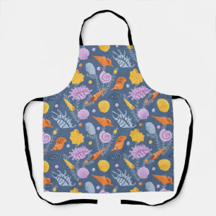 Colorfull seashells and algaes on blue apron