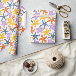 Colorfull starfishes on white wrapping paper