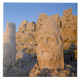 Colossal head statues of Gods guarding the Ceramic Tile