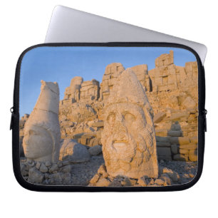 Colossal head statues of Gods guarding the Laptop Sleeve
