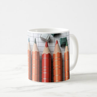 Coloured pencils are arranged to illustrate colour coffee mug
