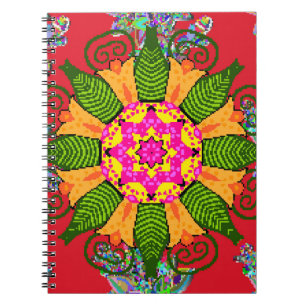 Coloured round floral mandala on a red, green and notebook