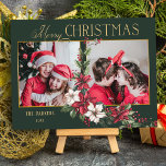 Colourful 2-Photo Merry Christmas Poinsettias Holiday Card<br><div class="desc">Festive and colourful holiday design featuring a two-photo template with custom gold Merry Christmas text graphic with a spray of traditional Christmas poinsettias and holly on a green background.</div>