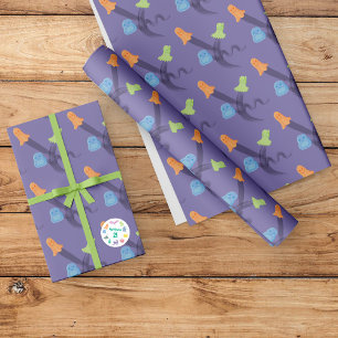 Colourful and cute ghosts flying on a lilac wrapping paper