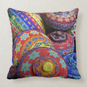 Colourful baskets made from coloured plastic beads cushion