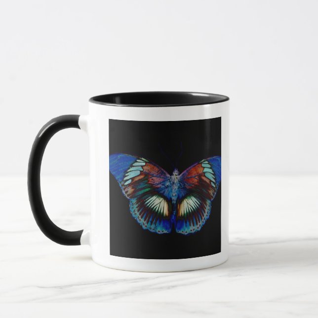 Colourful Butterfly design against black backdrop Mug (Left)
