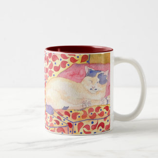 Colourful cat on sofa mug