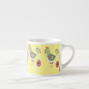 Colourful chicken and egg on yellow espresso cup