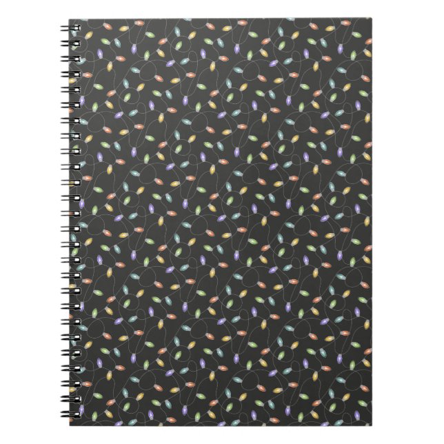 Colourful christmas lights garland pattern on blac notebook (Front)